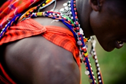 Close-up of a Masaï man dressed in colourful costume in Kenya